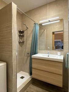 a bathroom with a sink and a shower and a toilet at Starfish Home, AWESOME VIEWS, FREE WIFI & NETFLIX in Morro del Jable