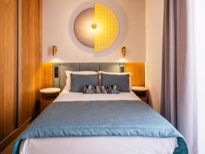 Postel nebo postele na pokoji v ubytování Grupotel Playa Camp de Mar - Adults Only