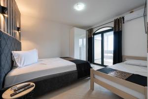 Postel nebo postele na pokoji v ubytování Villa Glamour