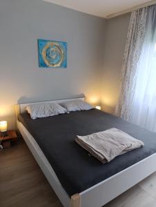 Postel nebo postele na pokoji v ubytování Harmonia guesthouse