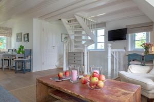 a living room with a table with fruit on it at Deichgraf 2 in Kampen