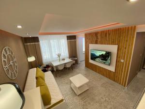 TV a/nebo společenská místnost v ubytování Apartmán Rysy