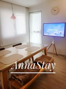 a living room with a table and a tv at AnnaStay in Seoul