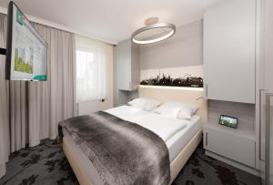 MASEVEN Stuttgart SI Centrum ehem SI-SUITES客房内的一张或多张床位