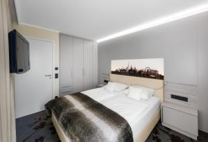 MASEVEN Stuttgart SI Centrum ehem SI-SUITES客房内的一张或多张床位