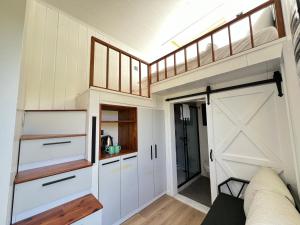 a tiny house with a loft conversion at Aden Garden Otel in Cesme