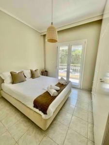 Ένα ή περισσότερα κρεβάτια σε δωμάτιο στο CalDi Sea View House