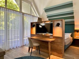 TV a/nebo společenská místnost v ubytování Hotel Mainpromenade ***S