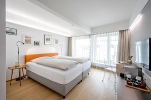 Katil atau katil-katil dalam bilik di Boutique Hotel Hauser