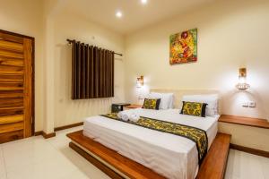 Postel nebo postele na pokoji v ubytování Paradise Villa Gili Air