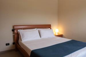 Postel nebo postele na pokoji v ubytování Bagno Lunezia