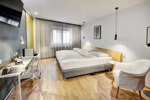 Katil atau katil-katil dalam bilik di Boutique Hotel Hauser