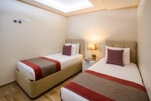 A bed or beds in a room at Cheya Sisli BNB Medical & Business City Center Tesvikiye Suites and Apartments