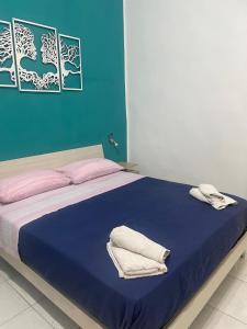 Letto o letti in una camera di DEA PARTHENOPE