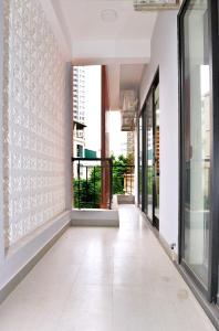 a hallway of a building with glass doors at Era Apartment Xuân Thuỷ in Hanoi