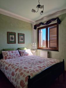 Postel nebo postele na pokoji v ubytování Casa Delle Coccole