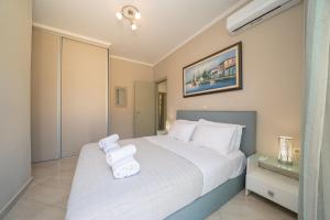 Posteľ alebo postele v izbe v ubytovaní Dendra Apartments at Skala