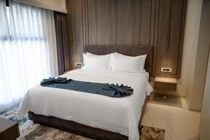 Ένα ή περισσότερα κρεβάτια σε δωμάτιο στο Lux Inn Hotel +46 φωτογραφίες