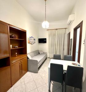 a living room with a couch and a table at Alloggio Vacanze Caieta in Gaeta