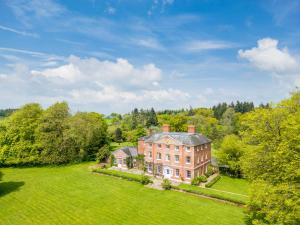an aerial view of a large house in a field at The Old Rectory in Hatfield