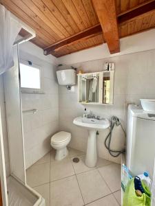 a bathroom with a toilet and a sink and a shower at Alloggio Vacanze Caieta in Gaeta +19 photos