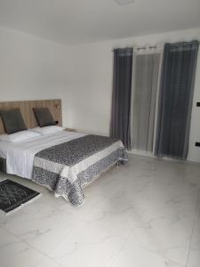 Postel nebo postele na pokoji v ubytování Apartman Vito