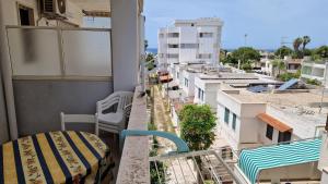 a balcony with a view of a city at Blu Celeste - by AP Apartment in Baia Verde