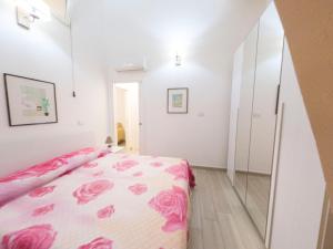 Giường trong phòng chung tại Home Torre dell' Astrologo