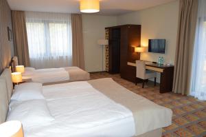 Łóżko lub łóżka w pokoju w obiekcie Hotel Via Baltica