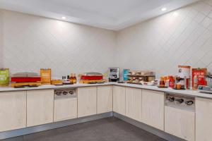 a kitchen with a counter with food on it at Hampton By Hilton San Jose Airport Costa Rica in Alajuela City