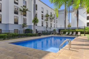 a swimming pool in front of a building at Hampton By Hilton San Jose Airport Costa Rica in Alajuela City