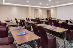 a conference room with tables and chairs with water bottles on them at Hampton By Hilton San Jose Airport Costa Rica in Alajuela City