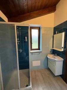 a bathroom with a shower and a sink at Casa vacanze La Cascina di Caterina in Castellabate +17 photos