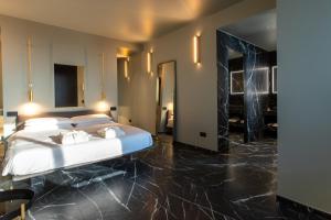 a bedroom with a bed and a large mirror at Suite 26 Rimini in Rimini