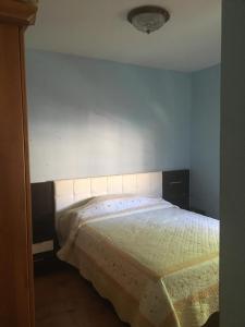 Кровать или кровати в номере Vivienda Vacacional La Candelaria II