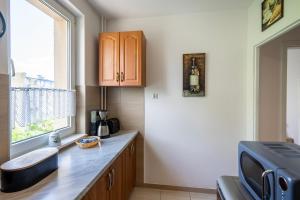 Kuchyň nebo kuchyňský kout v ubytování 02 Gdańsk Przymorze - Apartament Mieszkanie dla 6 os + 6 fotografií