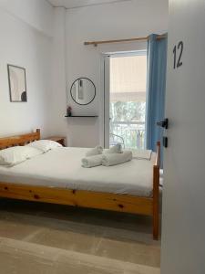 Ένα ή περισσότερα κρεβάτια σε δωμάτιο στο Sunshine Apartments and Rooms