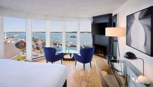 a living room with a view of the water at Radisson Blu Toronto Downtown in Toronto