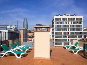 a group of chairs sitting on a roof at Loft Pere IV in Barcelona