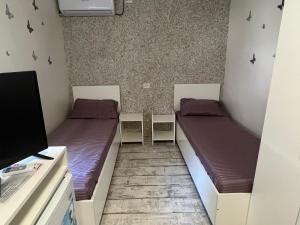 Postel nebo postele na pokoji v ubytování AmA