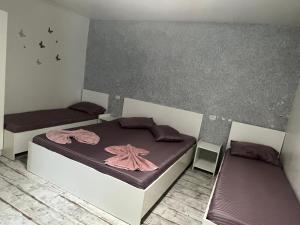 Postel nebo postele na pokoji v ubytování AmA