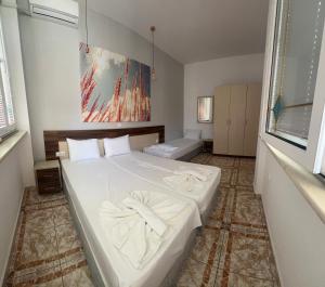 Postel nebo postele na pokoji v ubytování Ellas Hotel