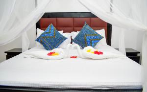 Postel nebo postele na pokoji v ubytování Zanzibar View Hotel