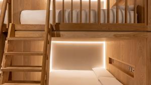 a small room with a bunk bed in a tiny house at Zedwell Piccadilly Circus in London