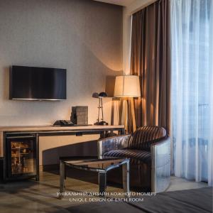 Телевизор и/или развлекательный центр в M1 Club Hotel