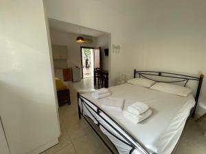 Postel nebo postele na pokoji v ubytování Petra Casa