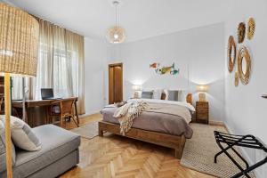 a bedroom with a bed and a desk and a chair at Family retreat House Begonija with pool and BBQ in Burići +50 photos