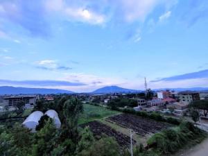 a view of a city with mountains in the background at Amirah Homes in Machakos