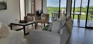a living room with a couch and a table at Casa en Laguna Soto Sur in Corrientes
