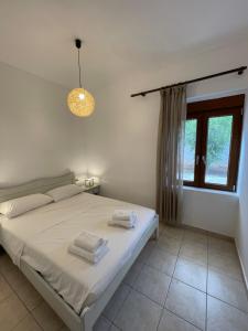 Postel nebo postele na pokoji v ubytování Petra Casa